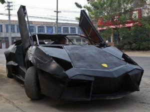 A friend of Wang Jian sits in a self-made replica of a Lamborghini Reventon in Suqian